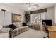 Bedroom featuring a large window, desk, office chair, sofa, and plant, ideal for relaxation or a home office at 11360 E Keats Ave # 70, Mesa, AZ 85209