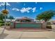 Community clubhouse entrance with sign surrounded by lush landscaping, situated on manicured grounds at 11360 E Keats Ave # 70, Mesa, AZ 85209