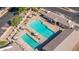 Aerial shot of community pools surrounded by lounge chairs and umbrellas, with cabana at 11360 E Keats Ave # 70, Mesa, AZ 85209