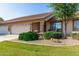 Charming home boasts a manicured front yard with lush landscaping and inviting stone accents on the porch at 11360 E Keats Ave # 70, Mesa, AZ 85209
