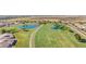 Aerial view of a beautiful golf course with multiple ponds and manicured green spaces at 11360 E Keats Ave # 70, Mesa, AZ 85209