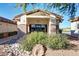 Community library entrance with stone accents, lush landscaping, and a serene reading environment at 11360 E Keats Ave # 70, Mesa, AZ 85209