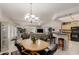 Open living area with dining table and kitchen access at 11360 E Keats Ave # 70, Mesa, AZ 85209