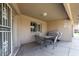 Covered patio featuring an outdoor dining table set with a grill, offering an ideal space for entertaining at 11360 E Keats Ave # 70, Mesa, AZ 85209