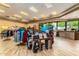 Retail space with clothing racks, golf equipment display, tile floor and front desk against window in this bright interior at 11360 E Keats Ave # 70, Mesa, AZ 85209