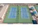 Bird's eye view of two tennis courts with green surfaces and white lines, benches nearby at 11360 E Keats Ave # 70, Mesa, AZ 85209