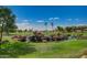 Water feature with rocks and waterfalls on the golf course at 11360 E Keats Ave # 70, Mesa, AZ 85209