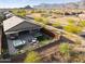 This home features a backyard oasis with a hot tub, fire pit, and well-manicured landscaping with mountain views at 12269 E Chiricahua Pl, Gold Canyon, AZ 85118