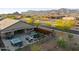Backyard oasis with hot tub, fire pit, grill, outdoor dining and mountain views in desert community at 12269 E Chiricahua Pl, Gold Canyon, AZ 85118