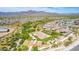Aerial view showcasing community basketball court, playground, picnic area, and scenic mountain backdrop at 12269 E Chiricahua Pl, Gold Canyon, AZ 85118
