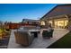 Backyard features a fire pit with seating, plus an outdoor kitchen, hot tub, and lounge chairs at 12269 E Chiricahua Pl, Gold Canyon, AZ 85118