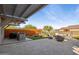 Spacious backyard patio with a built-in grill, ample seating, and artificial turf at 12269 E Chiricahua Pl, Gold Canyon, AZ 85118