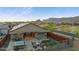 A fenced backyard featuring a hot tub, lounge chairs, a built-in grill, and an outdoor dining area at 12269 E Chiricahua Pl, Gold Canyon, AZ 85118