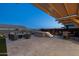 Outdoor space featuring a hot tub with steps, comfortable seating, and a stylish pergola for shaded relaxation at 12269 E Chiricahua Pl, Gold Canyon, AZ 85118