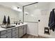 A sleek bathroom with double sinks, quartz countertops, stylish fixtures, and a frameless glass shower at 12269 E Chiricahua Pl, Gold Canyon, AZ 85118