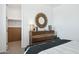 Bedroom with a dresser, sunburst mirror and closet access at 12269 E Chiricahua Pl, Gold Canyon, AZ 85118