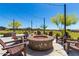A community fire pit with Adirondack chairs, perfect for outdoor gatherings at 12269 E Chiricahua Pl, Gold Canyon, AZ 85118