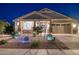 Charming single-story home featuring a manicured desert landscape and well-lit exterior at 12269 E Chiricahua Pl, Gold Canyon, AZ 85118