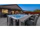 Backyard patio with a hot tub, outdoor bar and seating, and a covered patio, perfect for entertaining at 12269 E Chiricahua Pl, Gold Canyon, AZ 85118