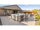 Backyard patio featuring a hot tub with seating, perfect for entertaining outdoors at 12269 E Chiricahua Pl, Gold Canyon, AZ 85118
