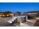 Backyard showcases a hot tub with steps, comfortable seating, and accent lighting for evening relaxation at 12269 E Chiricahua Pl, Gold Canyon, AZ 85118