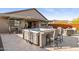 Outdoor patio boasting a hot tub with bar seating and a nearby dining area at 12269 E Chiricahua Pl, Gold Canyon, AZ 85118