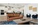 Bright living room offers contemporary furnishings and decor with an open flow into the modern kitchen at 12269 E Chiricahua Pl, Gold Canyon, AZ 85118