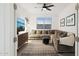 Cozy living room featuring a plush sectional sofa, stylish rug, and modern decor at 12269 E Chiricahua Pl, Gold Canyon, AZ 85118