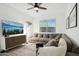 Bright living room with a comfortable sectional, patterned rug, and contemporary entertainment center at 12269 E Chiricahua Pl, Gold Canyon, AZ 85118