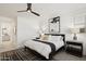 A bright main bedroom features a modern ceiling fan, with neutral decor and an ensuite bathroom at 12269 E Chiricahua Pl, Gold Canyon, AZ 85118