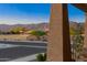 Scenic neighborhood view showcasing mature trees, lush landscaping, and mountain backdrop at 12269 E Chiricahua Pl, Gold Canyon, AZ 85118