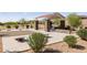 Community park with shaded picnic tables, walking paths, BBQ, and corn hole game at 12269 E Chiricahua Pl, Gold Canyon, AZ 85118