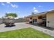 Large backyard with a patio, outdoor seating, and artificial turf at 12447 N 50Th Ln, Glendale, AZ 85304