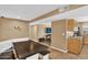 Bright dining area features hardwood floors, a custom built in table, and flows seamlessly into the kitchen at 12447 N 50Th Ln, Glendale, AZ 85304