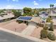 Inviting home with solar panels, rock landscaping, and a convenient attached two-car garage at 12447 N 50Th Ln, Glendale, AZ 85304