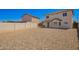 Large backyard with desert landscaping offers the possibility of customization and expansion at 12506 W Corrine Dr, El Mirage, AZ 85335