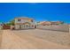 A spacious backyard features durable desert landscaping for low maintenance and water conservation at 12506 W Corrine Dr, El Mirage, AZ 85335
