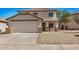 Front exterior showcasing a two-story home with desert landscaping and attached garage at 12506 W Corrine Dr, El Mirage, AZ 85335