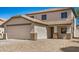 Charming two-story home featuring a two-car garage and well-maintained landscaping at 12506 W Corrine Dr, El Mirage, AZ 85335