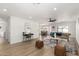 Spacious living room with wood floors, stylish decor, and an open floor plan at 12506 W Corrine Dr, El Mirage, AZ 85335