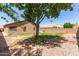 Large backyard with low maintenance landscaping and block fence for privacy at 13145 W Cambridge Ave, Goodyear, AZ 85395