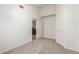 This is a cozy bedroom with neutral carpeting and a closet, creating a comfortable and relaxing space at 13145 W Cambridge Ave, Goodyear, AZ 85395