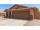Charming single-story home with a well-maintained front yard, desert landscaping, and a two-car garage at 13145 W Cambridge Ave, Goodyear, AZ 85395