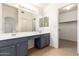 Bathroom includes a dual sink vanity with gray cabinets and ample counter space at 13145 W Cambridge Ave, Goodyear, AZ 85395