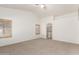 Spacious bedroom boasts neutral carpet, vaulted ceilings, and abundant natural light at 13145 W Cambridge Ave, Goodyear, AZ 85395