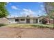 The home's back exterior shows a covered patio and well-maintained landscaping at 13816 N 46Th St, Phoenix, AZ 85032
