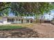 Expansive backyard with mature trees and a covered patio, perfect for outdoor entertaining at 13816 N 46Th St, Phoenix, AZ 85032