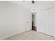 Neutral bedroom with tile flooring, closet space, and bright natural lighting at 13816 N 46Th St, Phoenix, AZ 85032