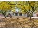 Charming single-story home with mature, flowering trees and a well-manicured lawn at 13816 N 46Th St, Phoenix, AZ 85032
