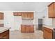 Spacious kitchen with tile flooring, ample storage, and views to other living spaces at 13816 N 46Th St, Phoenix, AZ 85032